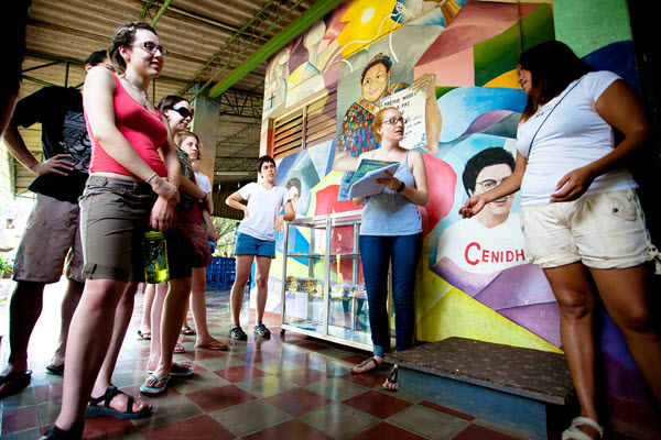 Students by mural in Nicaragua