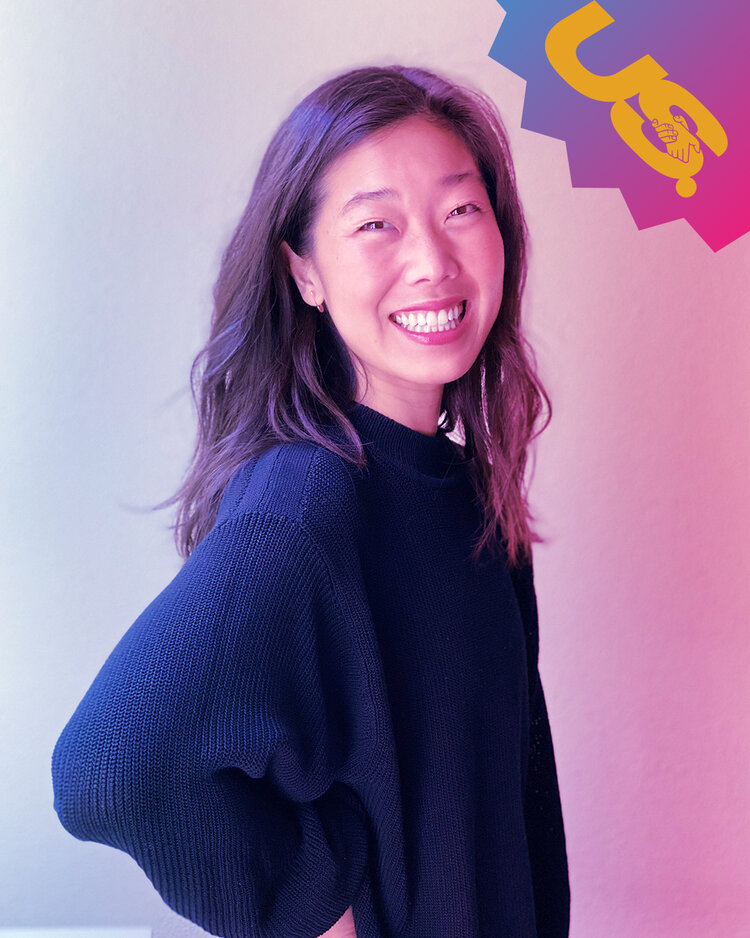 Kamauri Yeh, an Asian woman smiling in front of a multicolored neon backdrop