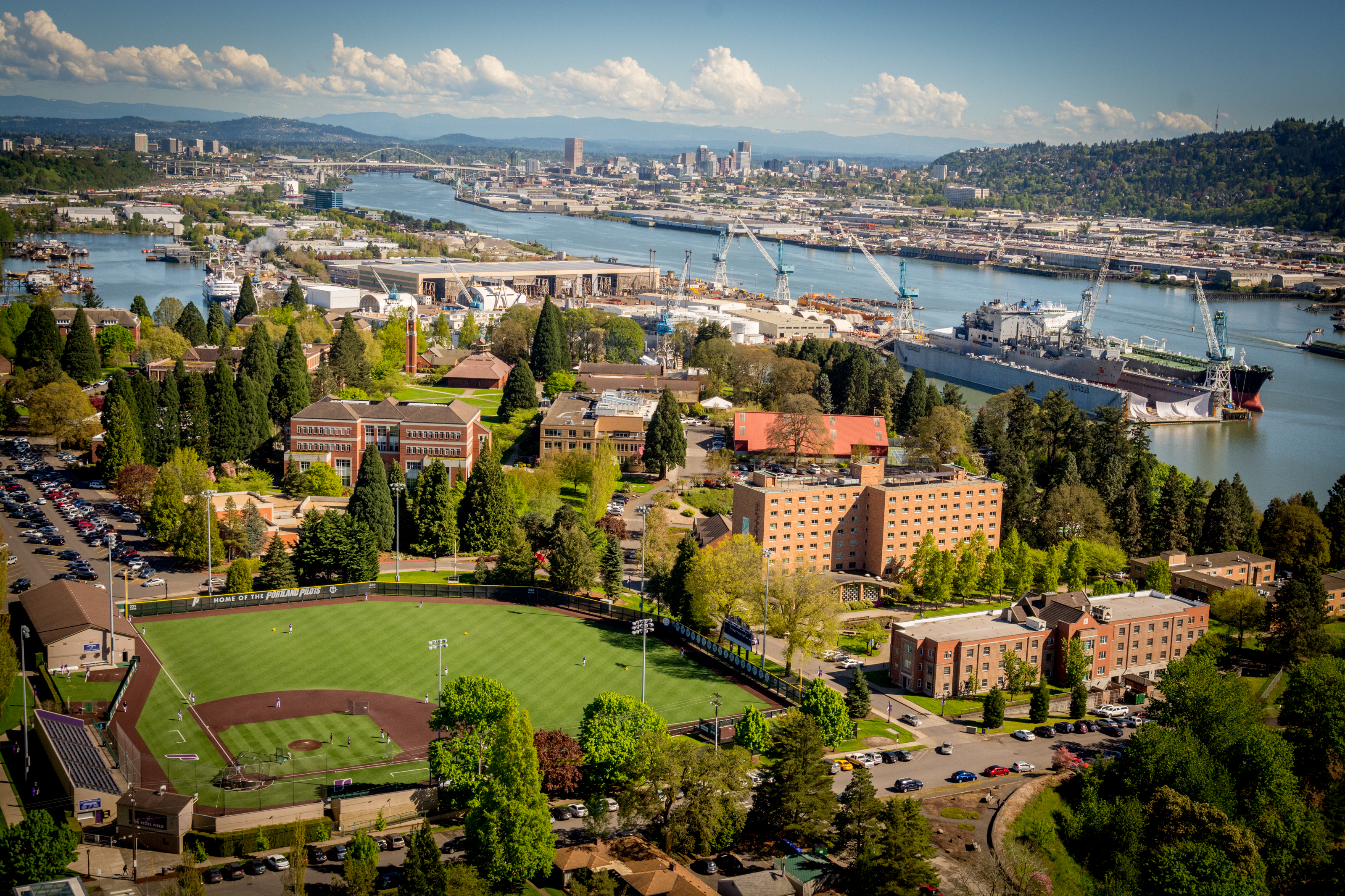 An aerial view of the UP campus and Portland skyline
