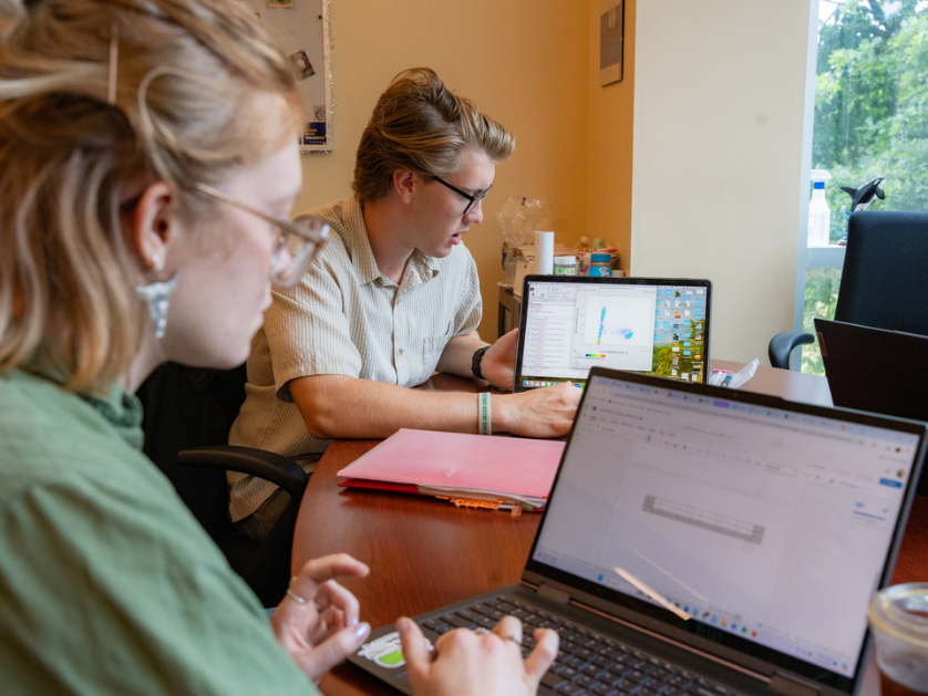 Students working at computers in a study area