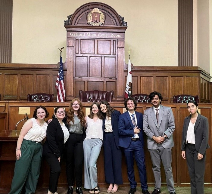 UP's Mock Trial Team standing in a California court room.