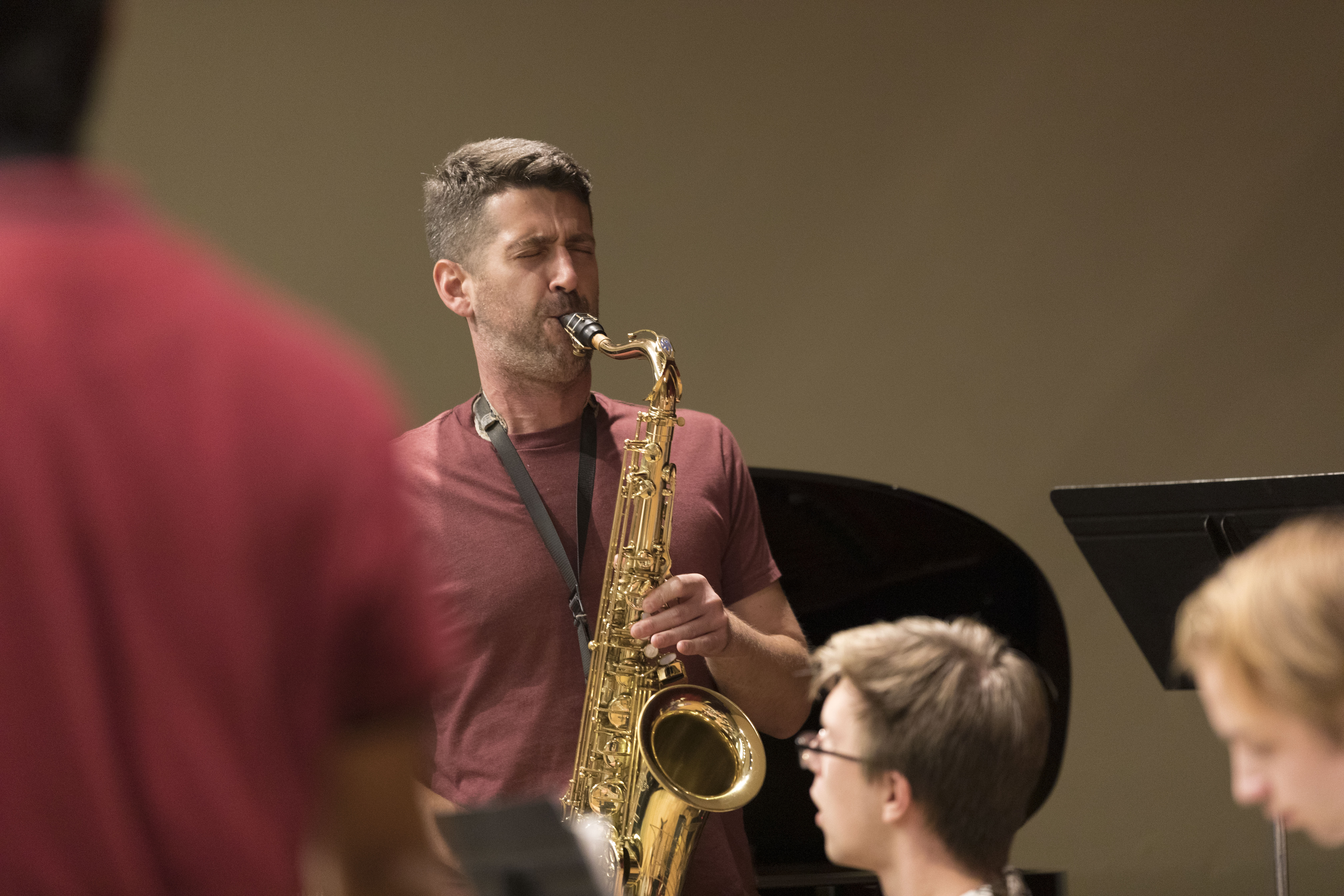 Donnie Norton, UP Jazz Professor, playing the saxophone with students